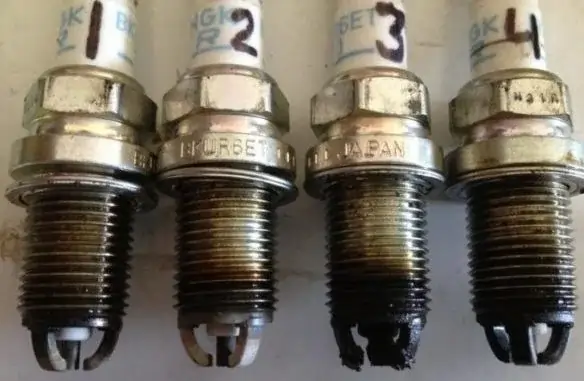 Fouled and Damaged Spark Plugs Due to Engine Misfires